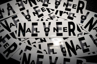 Never Alone Sticker